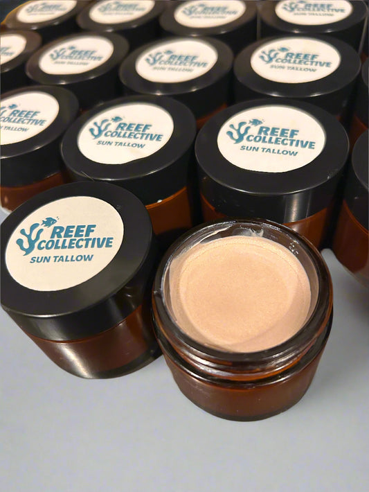 Multiple containers of a cosmetic product with visible brand label on a reflective surface